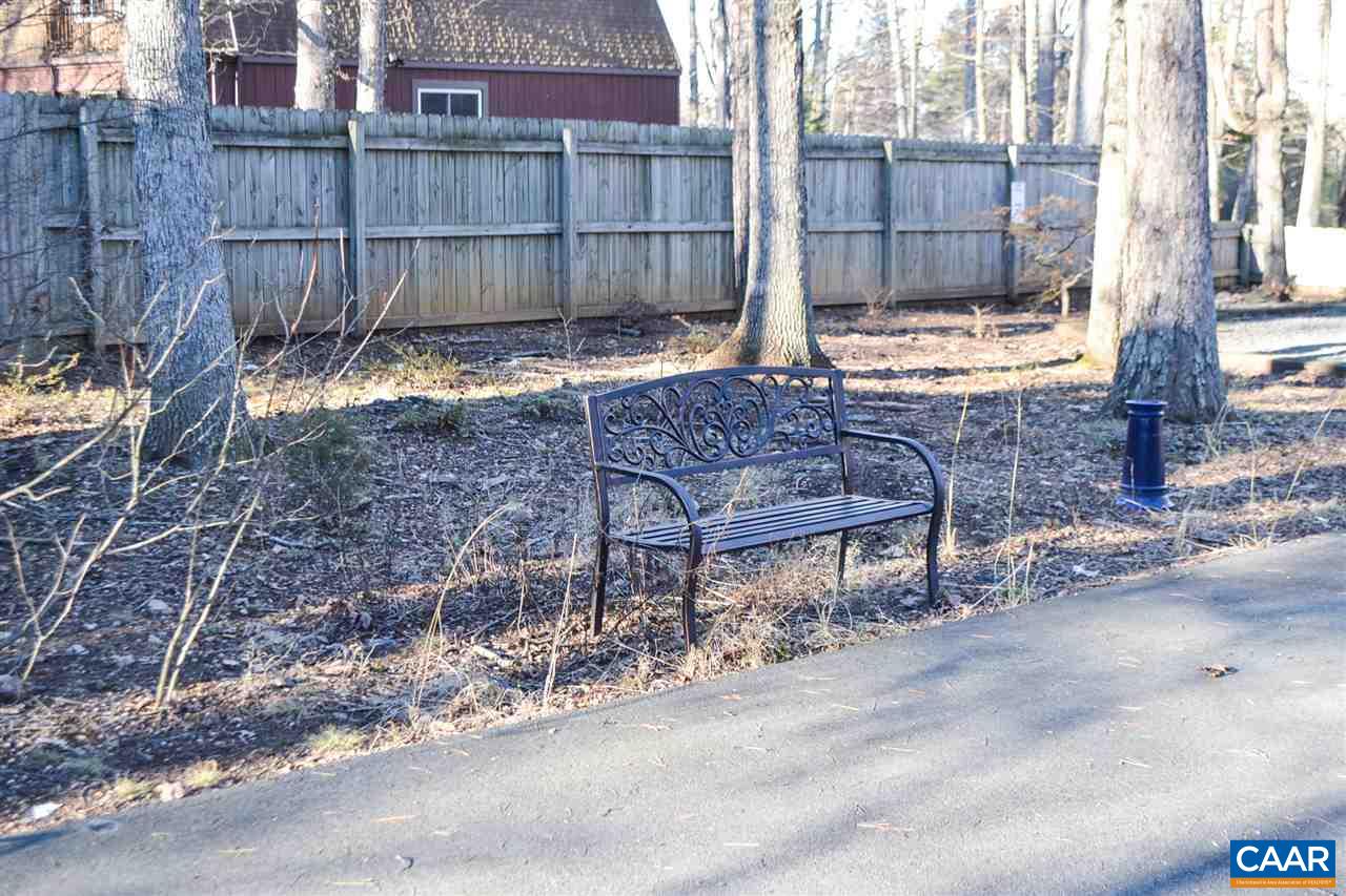 2738 Rio Mills Road Earlysville, VA 22936 - Photo 13 of 48 a view of a backyard with a bench