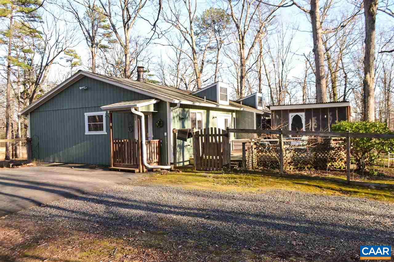 2738 Rio Mills Road Earlysville, VA 22936 - Photo 14 of 48 a view of a house with large windows and a small yard