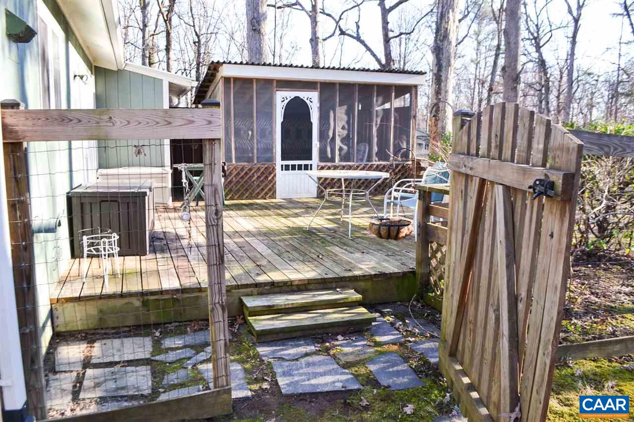 2738 Rio Mills Road Earlysville, VA 22936 - Photo 15 of 48 a view of a house with a porch and furniture