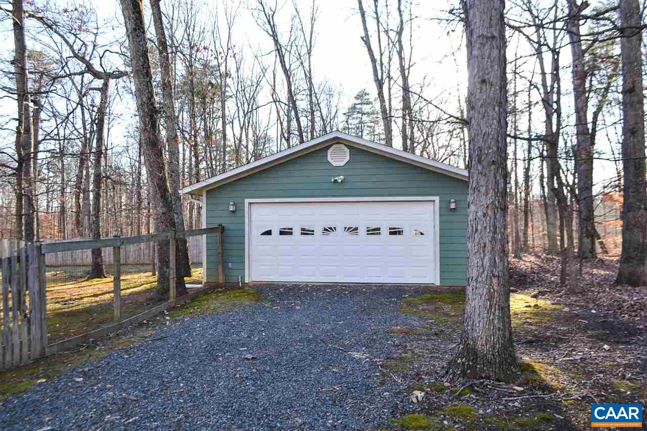 2738 Rio Mills Road Earlysville, VA 22936 - Photo 2 of 48 a view of a house with large trees and a large tree