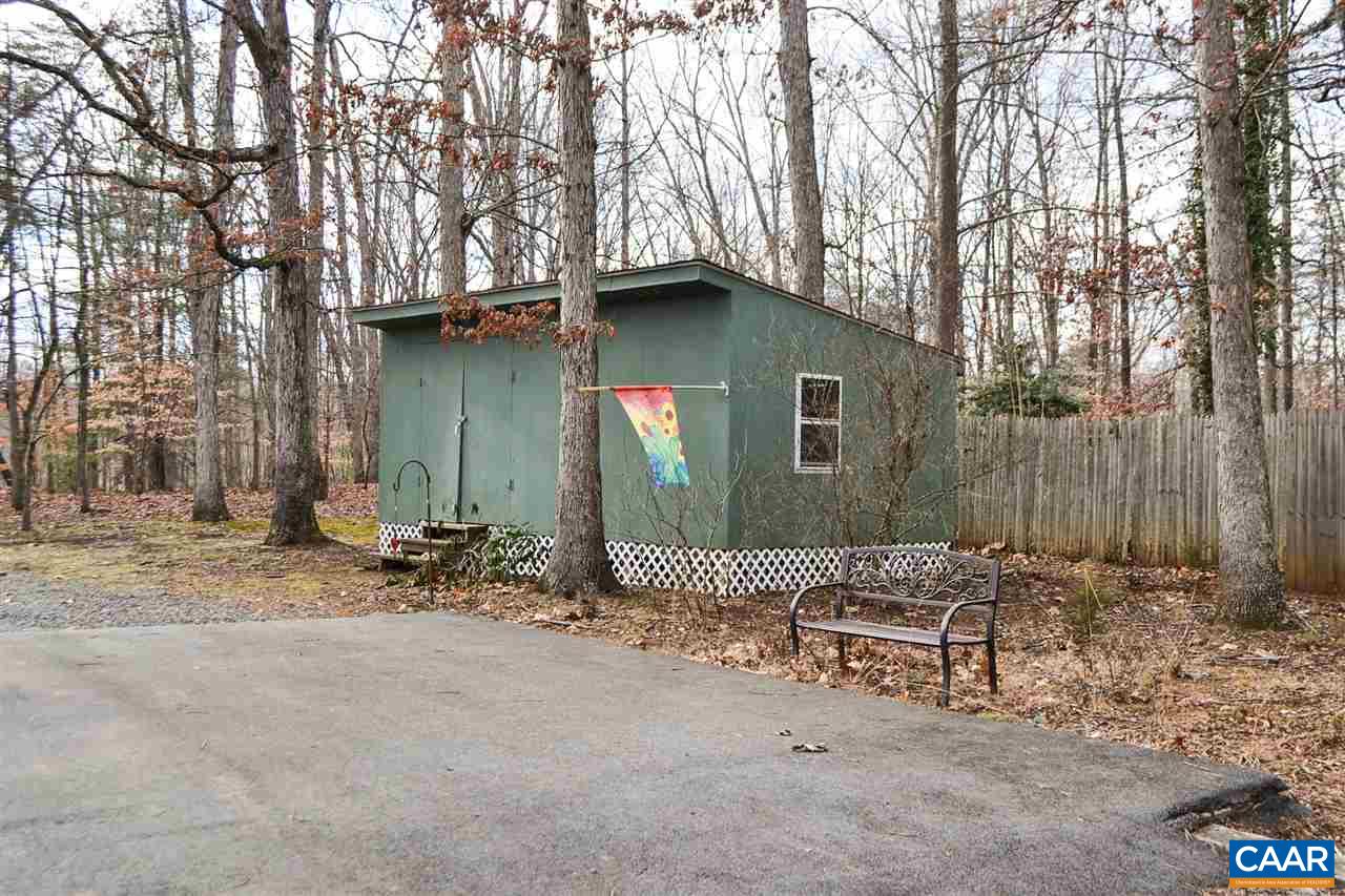 2738 Rio Mills Road Earlysville, VA 22936 - Photo 23 of 48 a backyard of a house with table and chairs