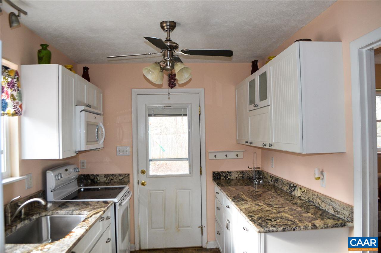 2738 Rio Mills Road Earlysville, VA 22936 - Photo 27 of 48 a kitchen with stainless steel appliances granite countertop a sink stove and refrigerator