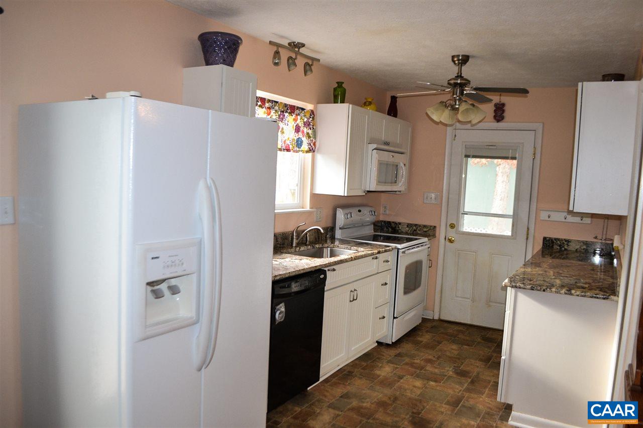 2738 Rio Mills Road Earlysville, VA 22936 - Photo 28 of 48 a kitchen with cabinets and stainless steel appliances
