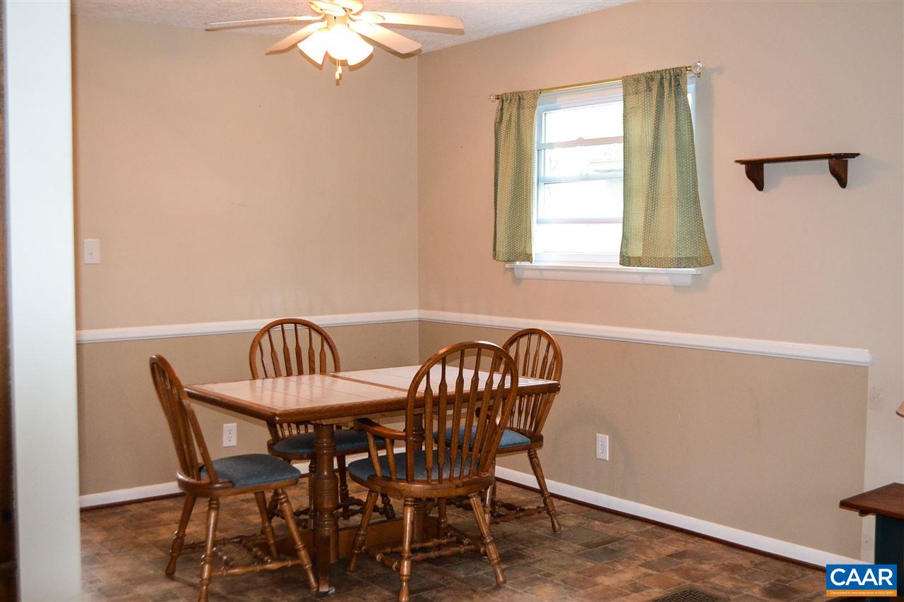 2738 Rio Mills Road Earlysville, VA 22936 - Photo 34 of 48 a view of a dining room with furniture and a chandelier