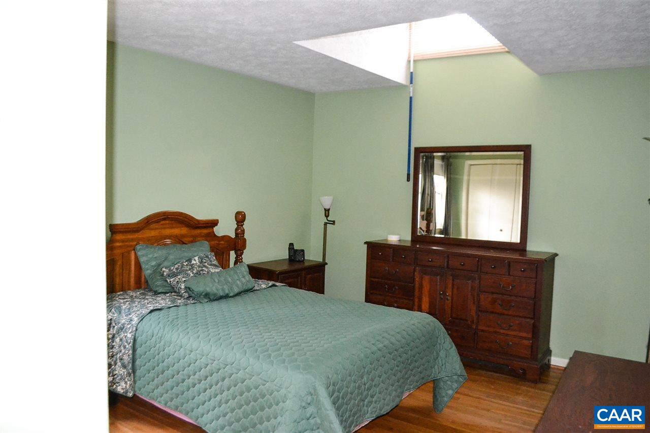 2738 Rio Mills Road Earlysville, VA 22936 - Photo 42 of 48 a bedroom with a bed and a dresser
