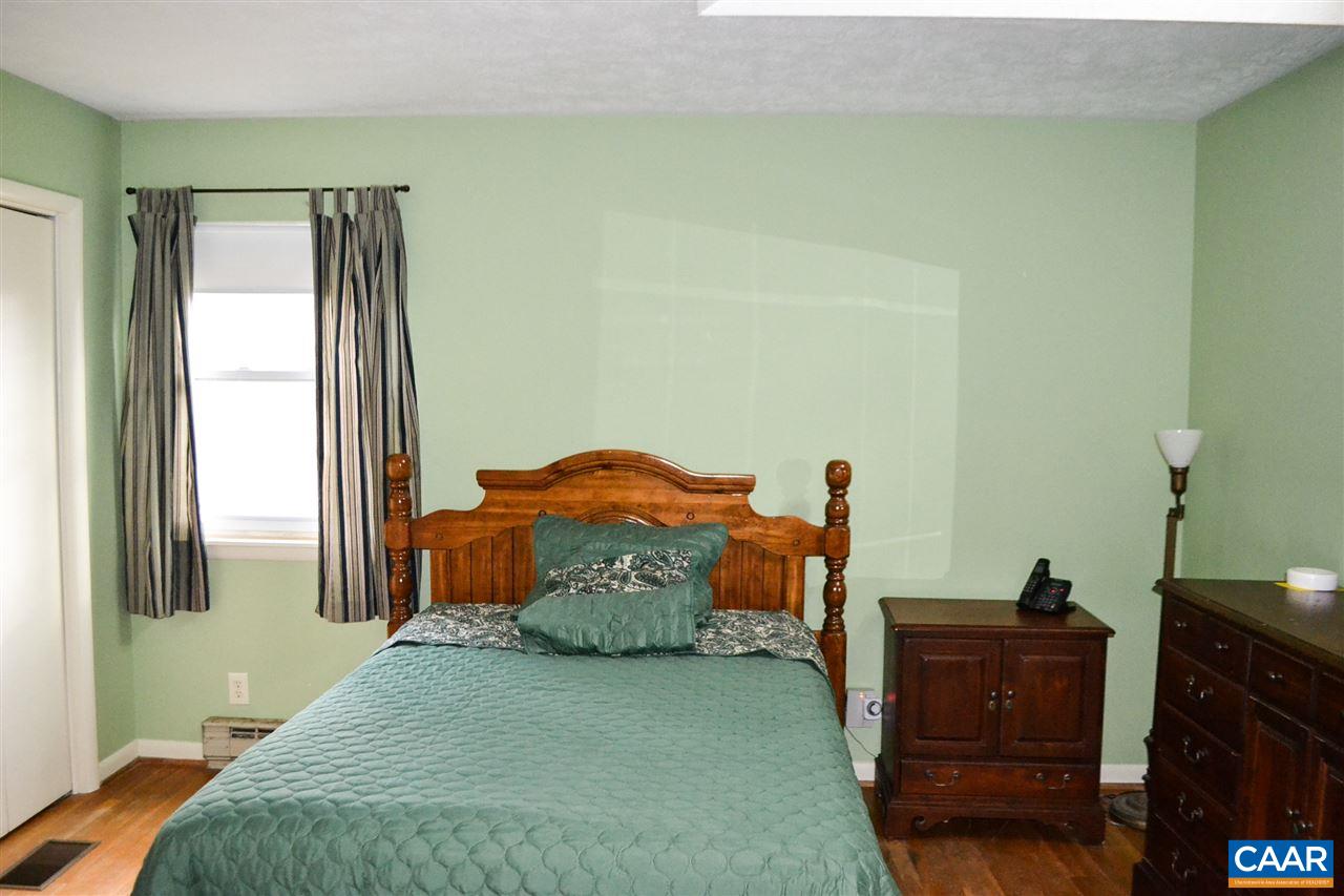2738 Rio Mills Road Earlysville, VA 22936 - Photo 43 of 48 a bedroom with a bed and a mirror