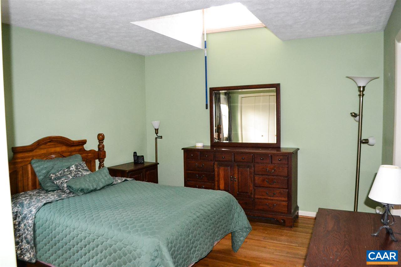 2738 Rio Mills Road Earlysville, VA 22936 - Photo 44 of 48 a bedroom with a bed and a dresser