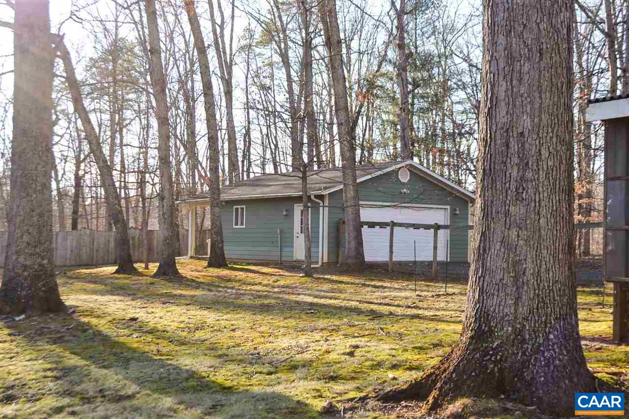 2738 Rio Mills Road Earlysville, VA 22936 - Photo 9 of 48 a front view of a house with a yard