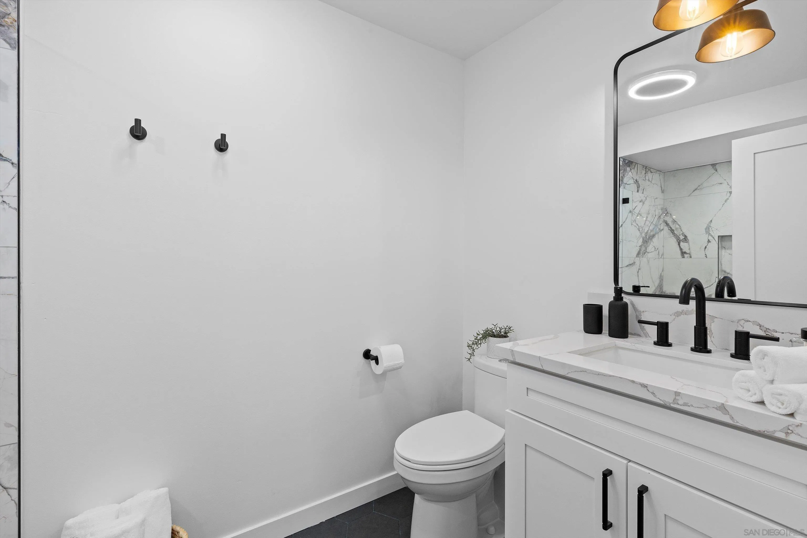 6111 Rancho Mission Road, Unit 313 San Diego, CA 92108 - Photo 14 of 25 a bathroom with a sink and a toilet