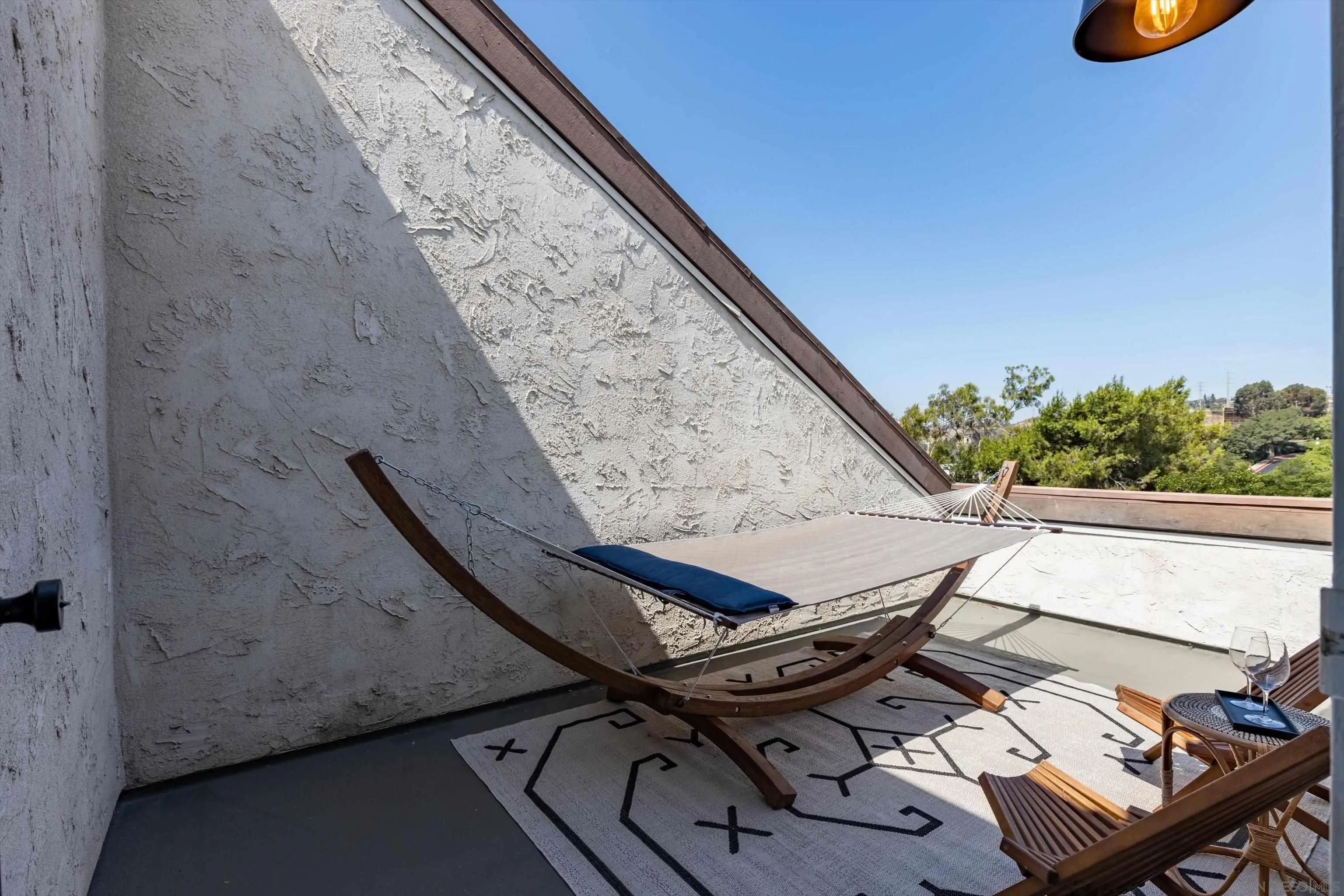 6111 Rancho Mission Road, Unit 313 San Diego, CA 92108 - Photo 19 of 25 a view of a balcony with chairs