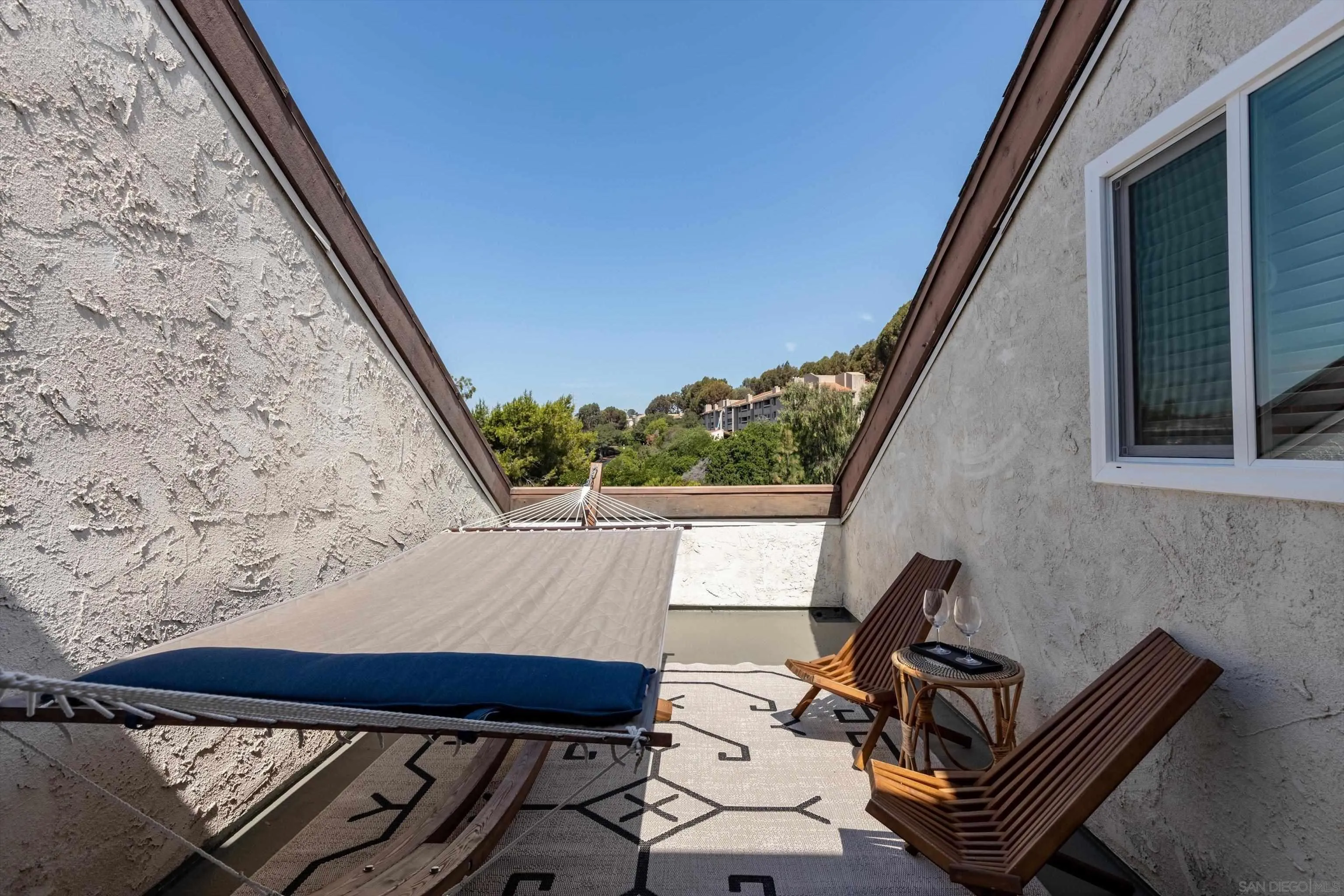 6111 Rancho Mission Road, Unit 313 San Diego, CA 92108 - Photo 20 of 25 a balcony view with couple of chairs