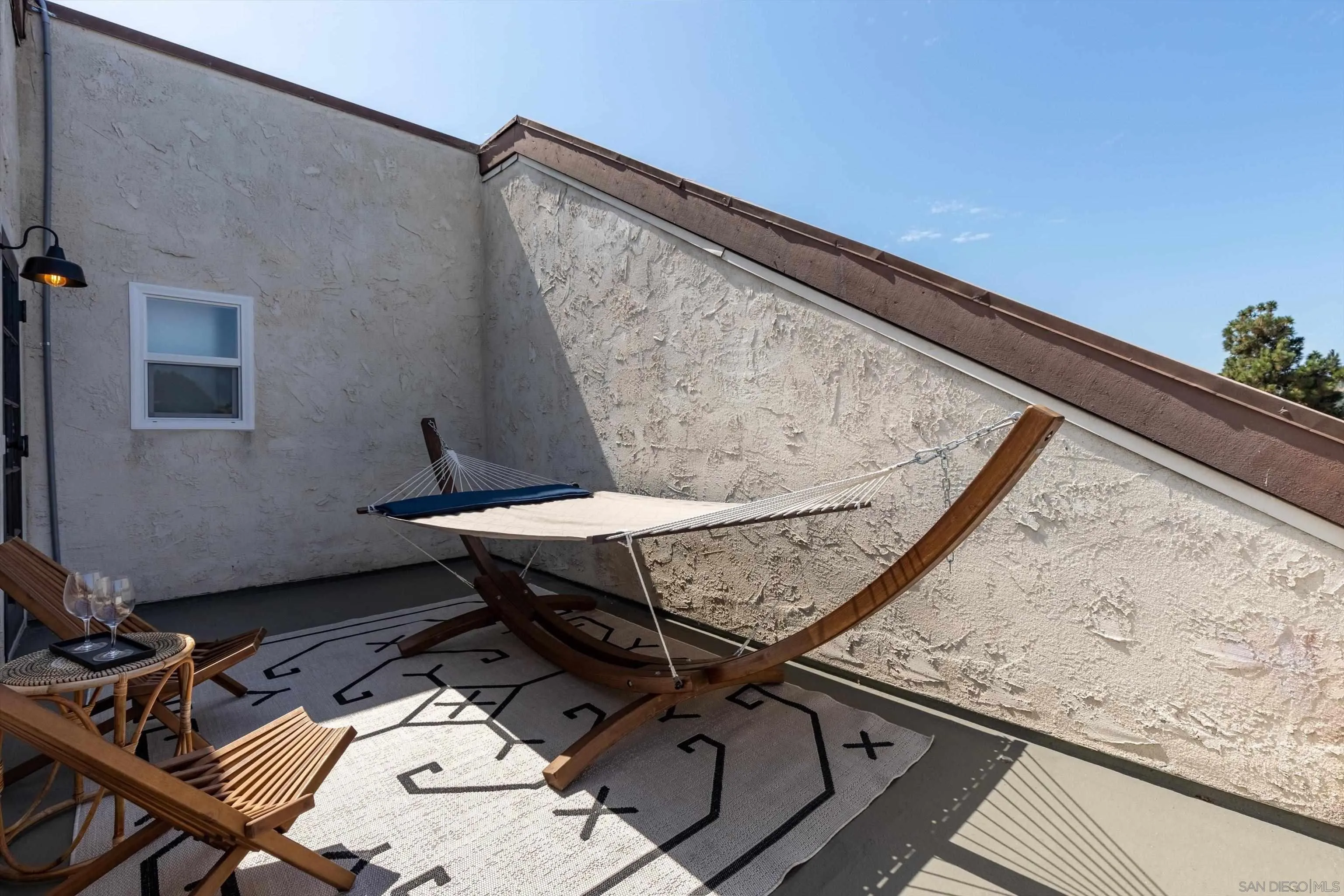 6111 Rancho Mission Road, Unit 313 San Diego, CA 92108 - Photo 21 of 25 a view of a terrace with wooden floor and seating space