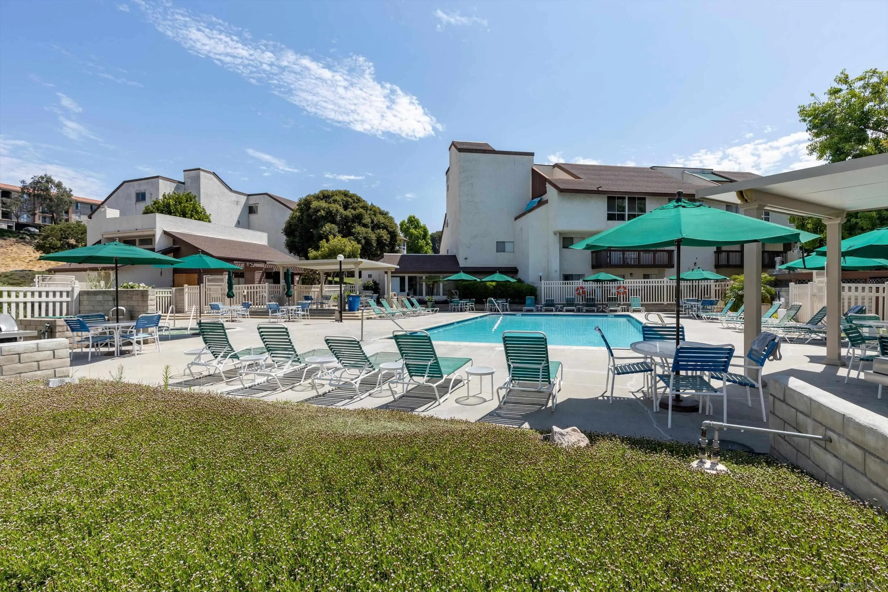 6111 Rancho Mission Road, Unit 313 San Diego, CA 92108 - Photo 22 of 25 a view of a chairs and table in patio with a fire pit