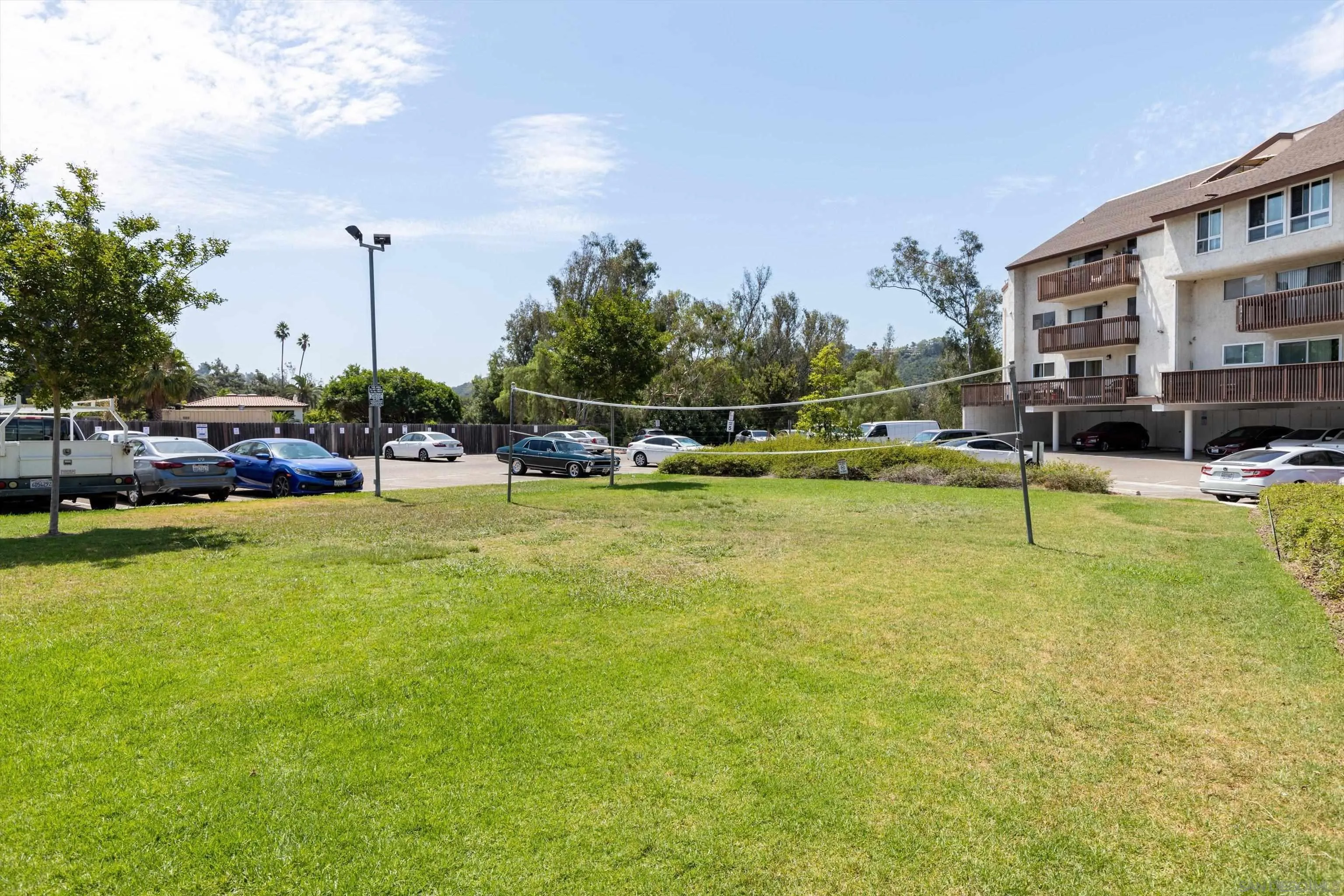 6111 Rancho Mission Road, Unit 313 San Diego, CA 92108 - Photo 24 of 25 a view of swimming pool with outdoor seating and plants