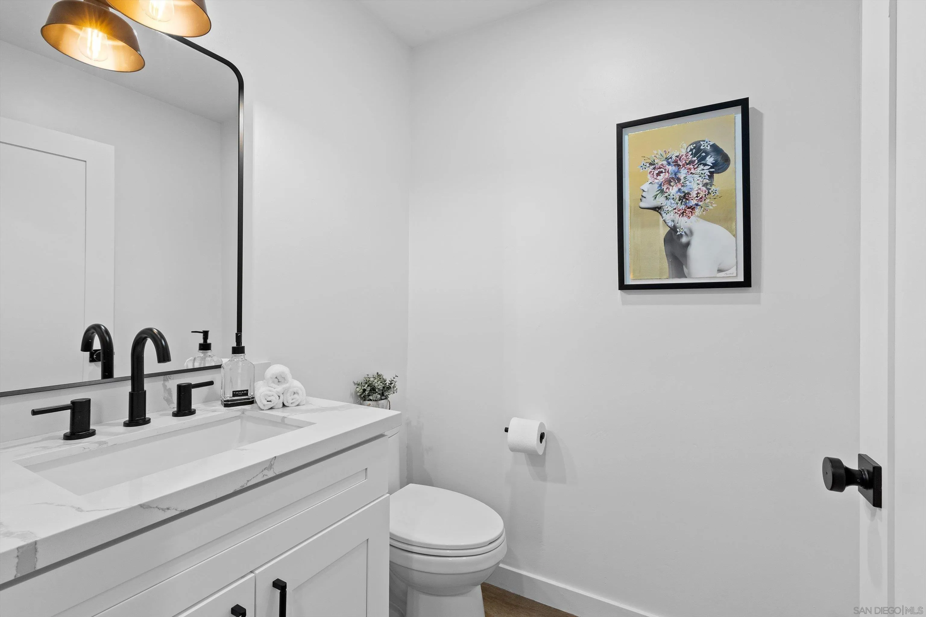 6111 Rancho Mission Road, Unit 313 San Diego, CA 92108 - Photo 8 of 25 a bathroom with a sink vanity and toilet