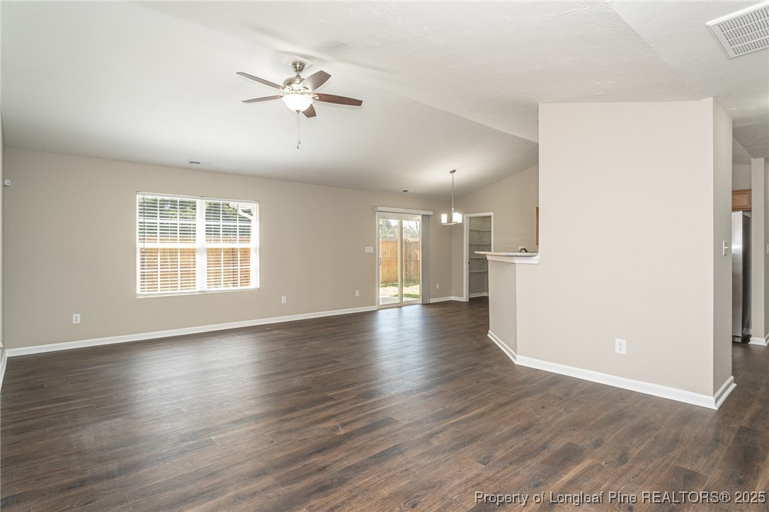 2830 John McMillan Road Hope Mills, NC 28348 - Photo 11 of 46 a view of an empty room with wooden floor and a window