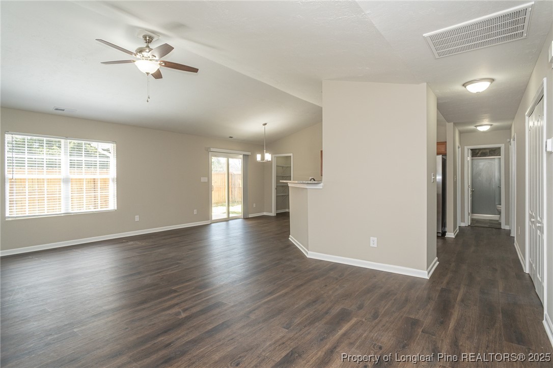 2830 John McMillan Road Hope Mills, NC 28348 - Photo 19 of 46 a view of an empty room with wooden floor and a window