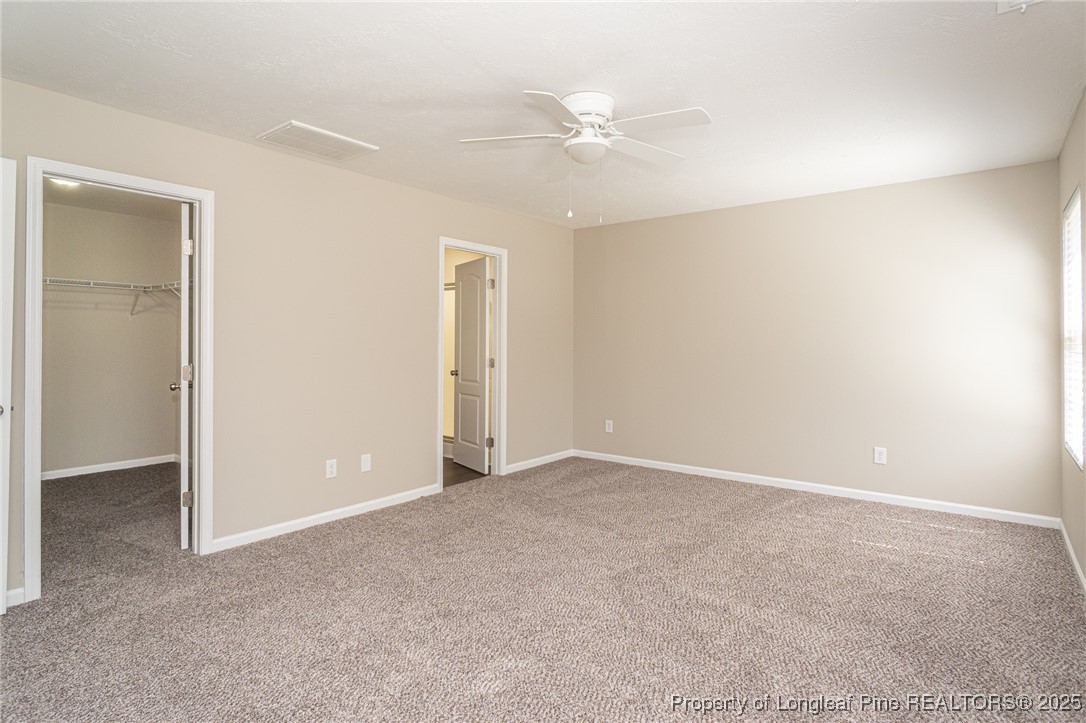 2830 John McMillan Road Hope Mills, NC 28348 - Photo 23 of 46 a view of an empty room with a ceiling fan