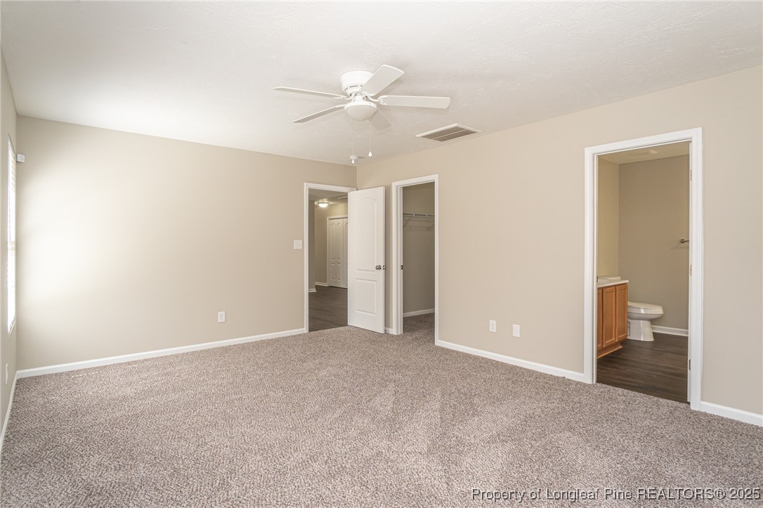 2830 John McMillan Road Hope Mills, NC 28348 - Photo 24 of 46 a view of a room with a ceiling fan and bathroom