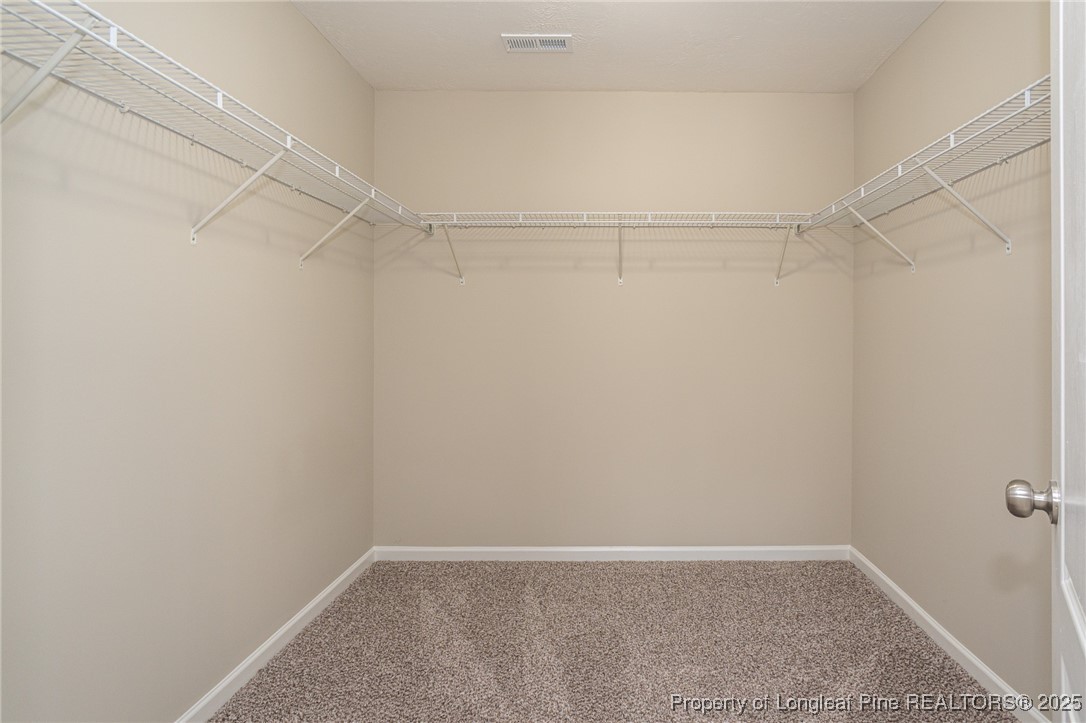 2830 John McMillan Road Hope Mills, NC 28348 - Photo 25 of 46 a view of an empty walk in closet