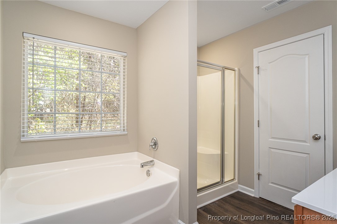 2830 John McMillan Road Hope Mills, NC 28348 - Photo 31 of 46 a bathroom with a bathtub and a shower