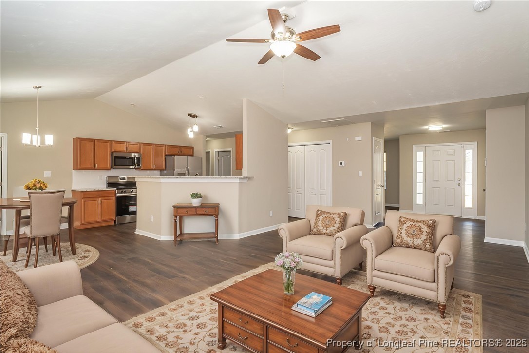 2830 John McMillan Road Hope Mills, NC 28348 - Photo 4 of 46 a living room with furniture and kitchen view