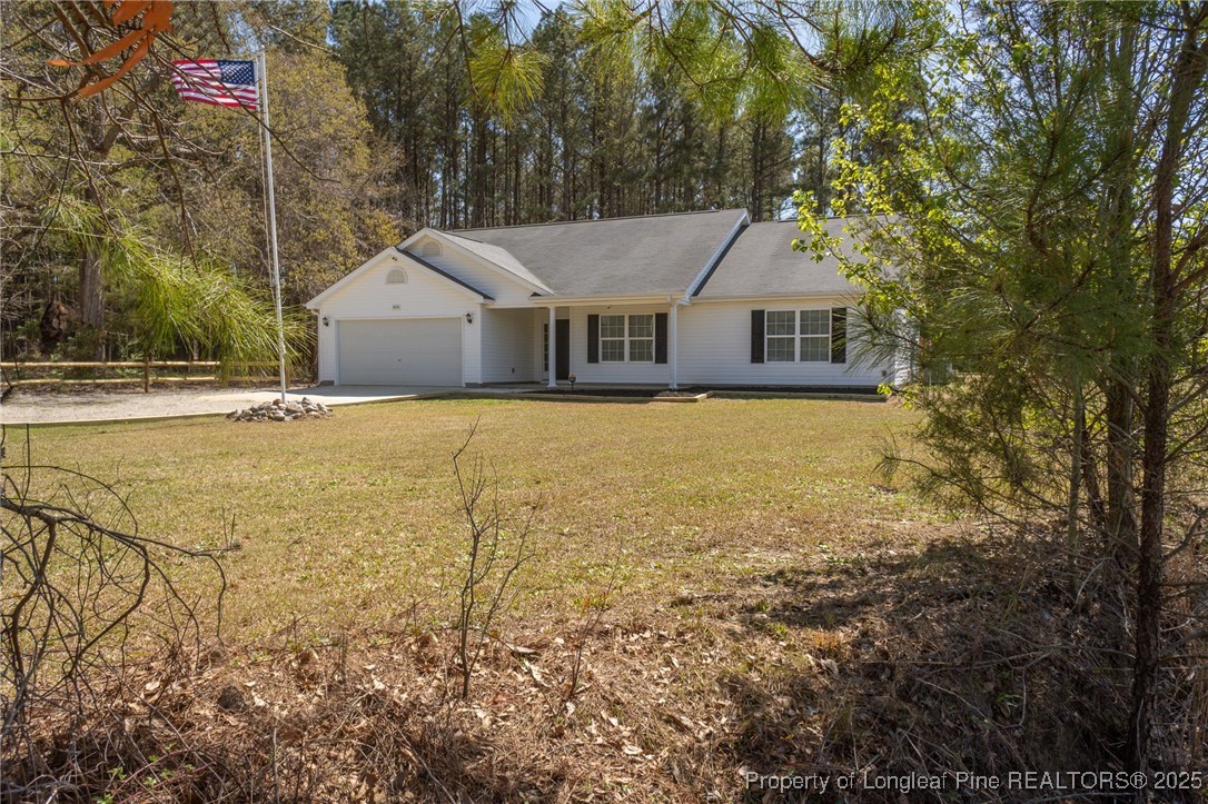 2830 John McMillan Road Hope Mills, NC 28348 - Photo 46 of 46 a house with a field