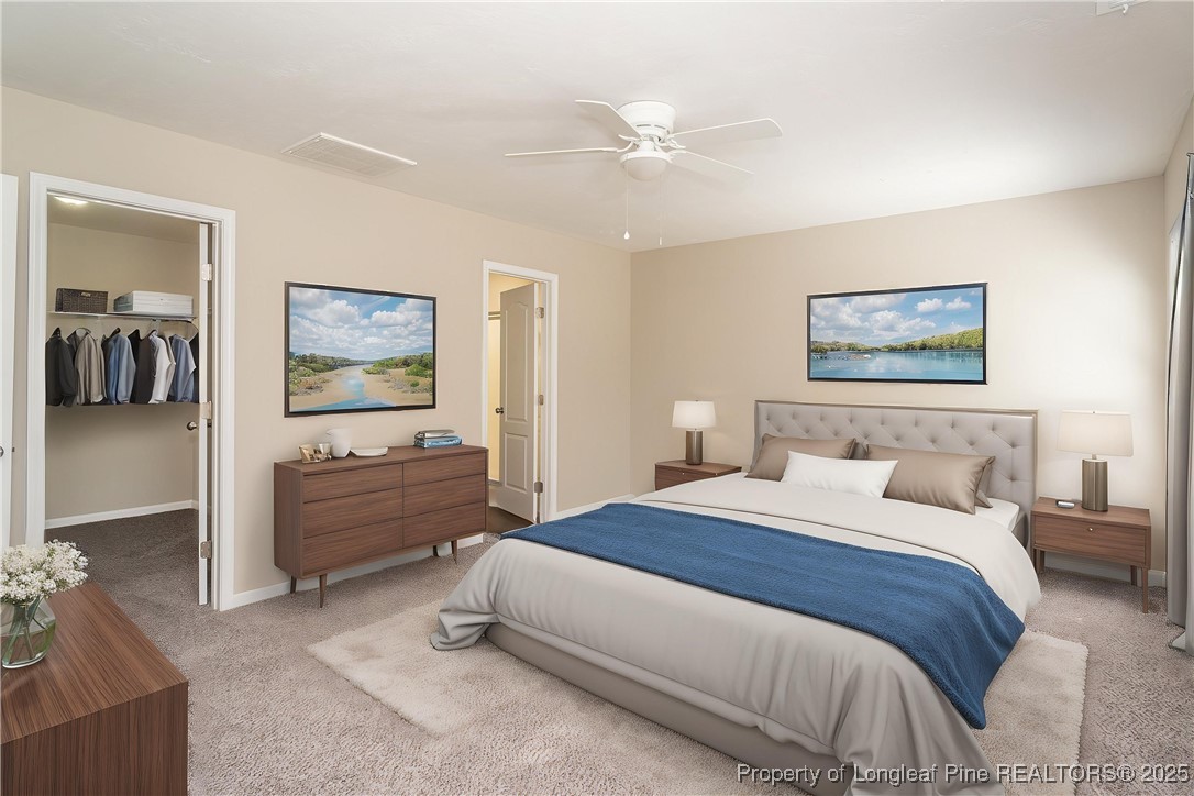 2830 John McMillan Road Hope Mills, NC 28348 - Photo 5 of 46 a spacious bedroom with a bed and a chandelier