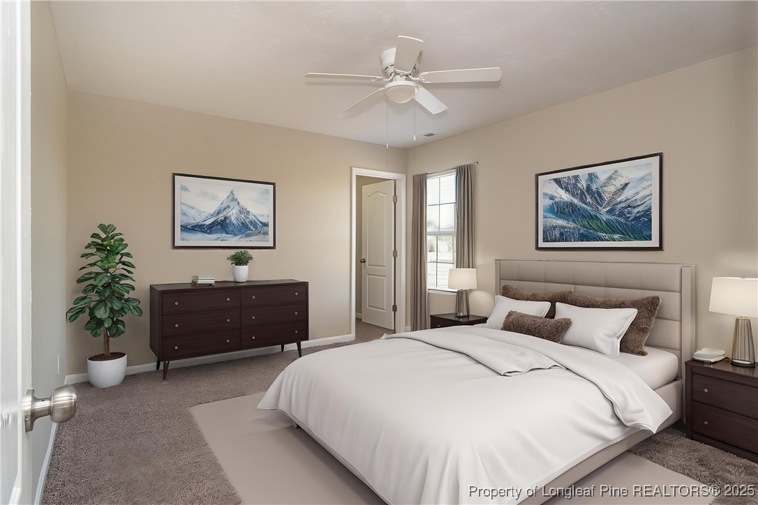 2830 John McMillan Road Hope Mills, NC 28348 - Photo 6 of 46 a bedroom with a large bed and a chandelier