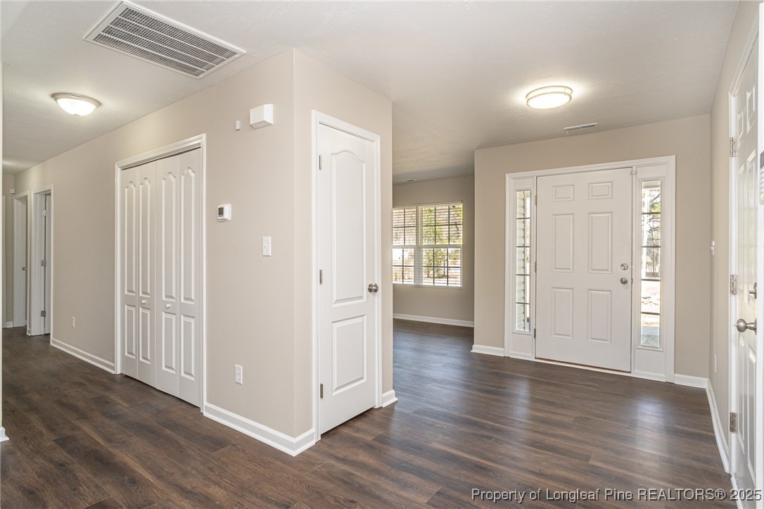 2830 John McMillan Road Hope Mills, NC 28348 - Photo 8 of 46 a view of a hallway with wooden floor