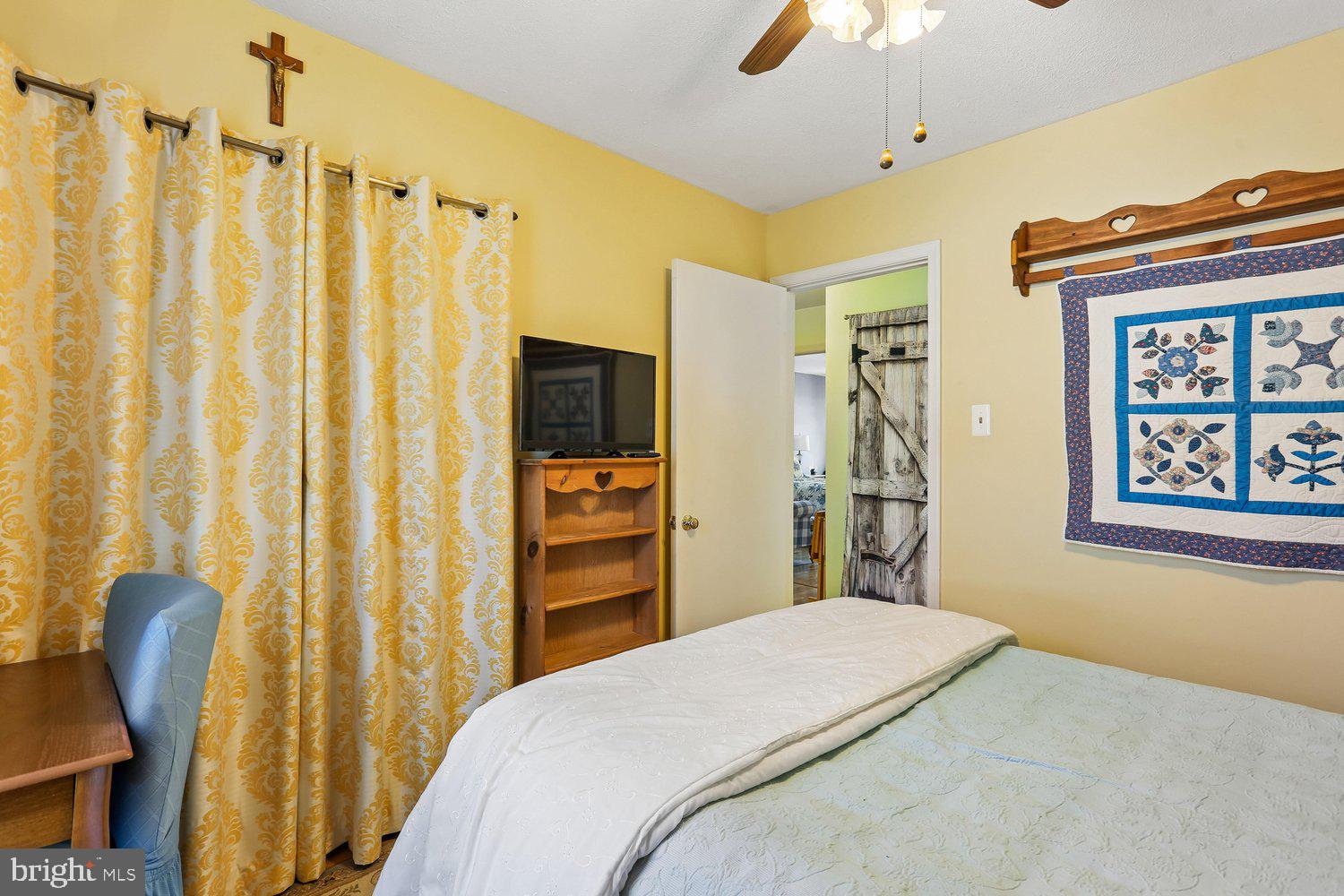 14822 Rose Trellis Place Silver Spring, MD 20906 - Photo 34 of 65 a bedroom with a bed and a chair