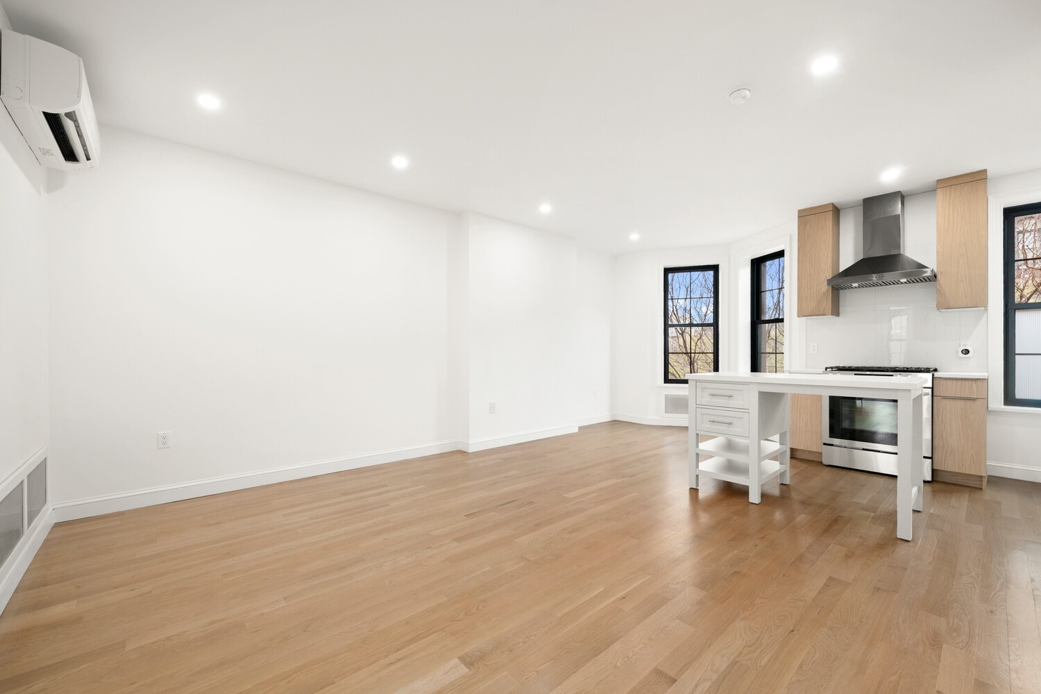 422 4th Avenue, Unit 3 Brooklyn, NY 11215 - Photo 2 of 11 a view of kitchen with furniture and wooden floor