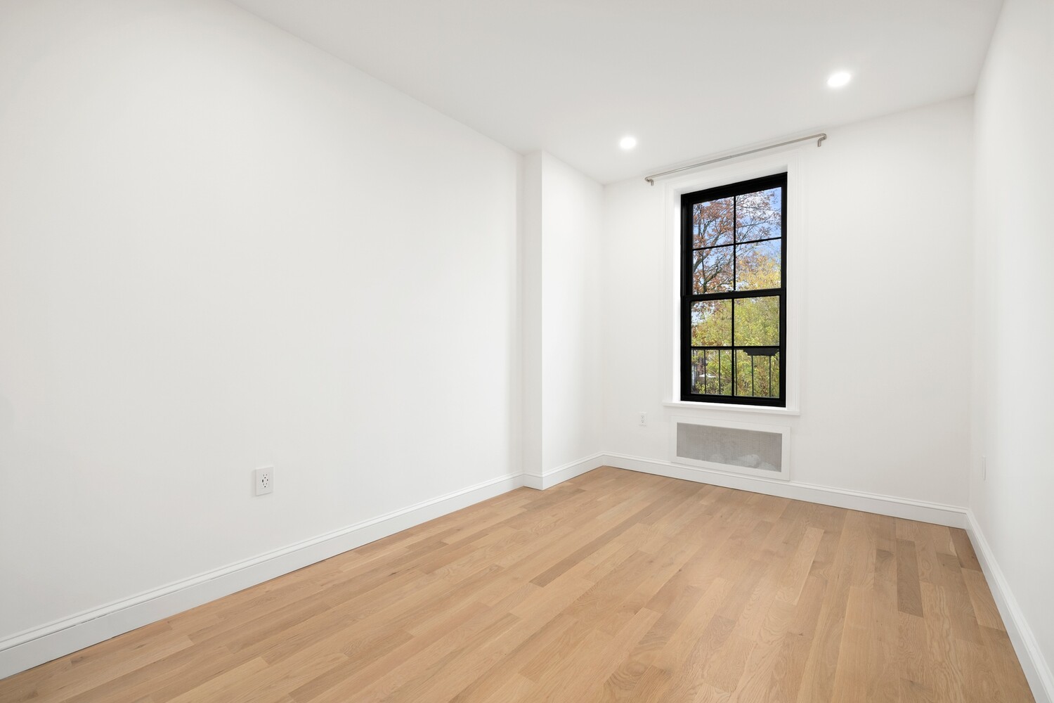 422 4th Avenue, Unit 3 Brooklyn, NY 11215 - Photo 4 of 11 wooden floor in an empty room with a window