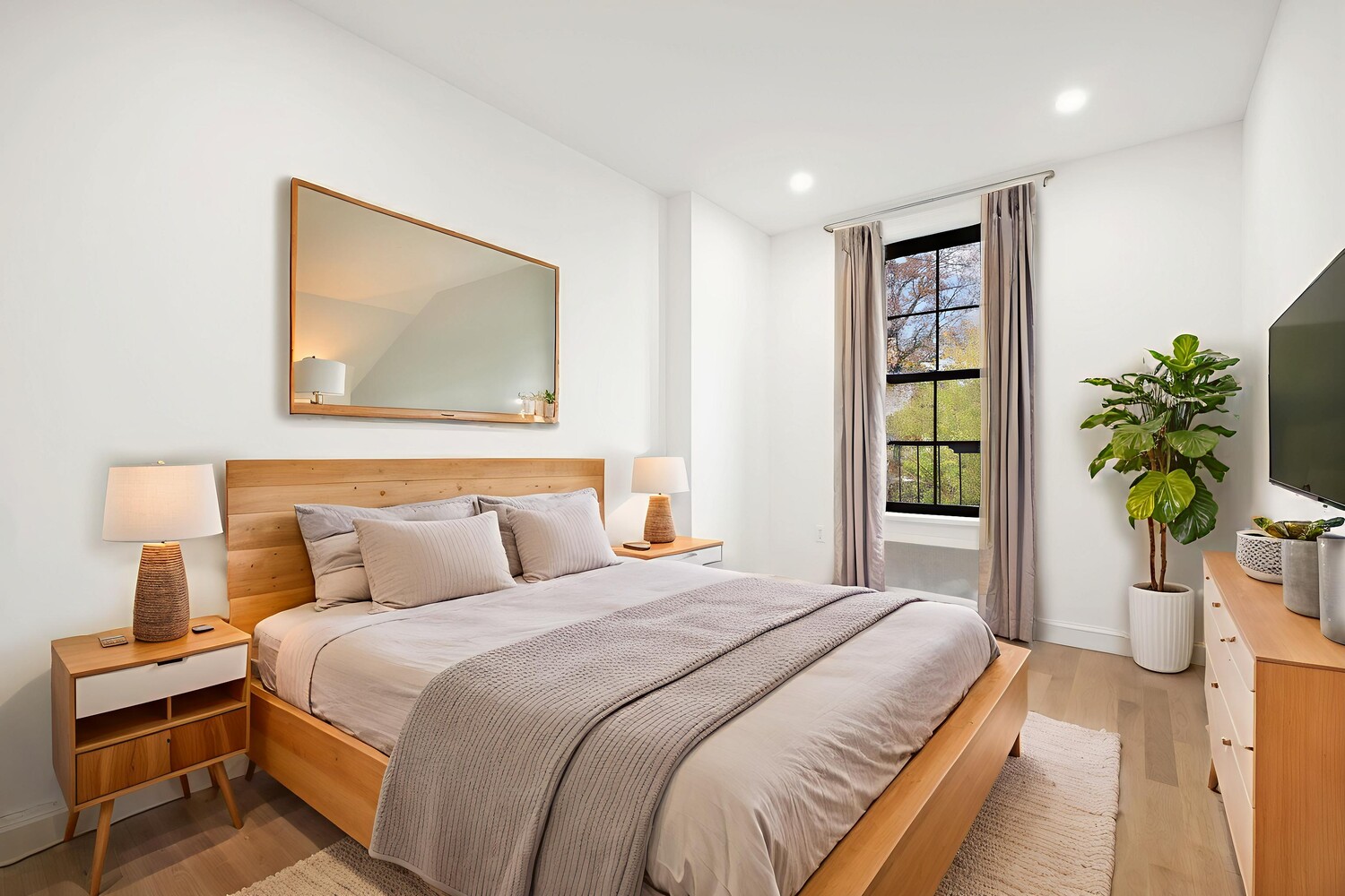 422 4th Avenue, Unit 3 Brooklyn, NY 11215 - Photo 8 of 11 a bedroom with a bed and a painting on the wall