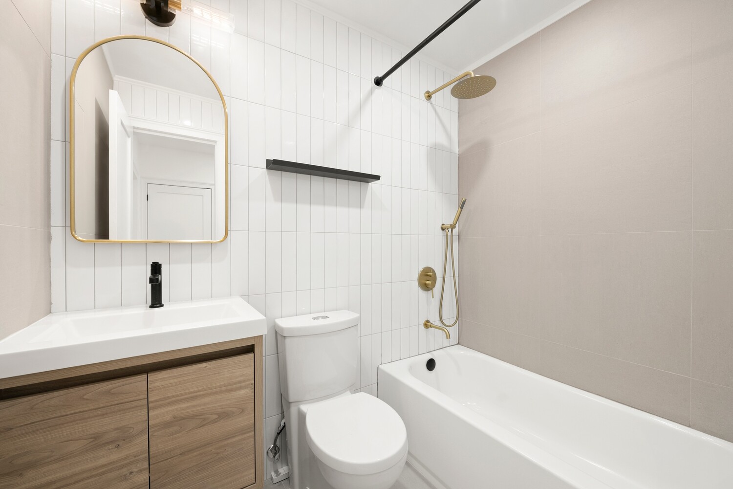 422 4th Avenue, Unit 3 Brooklyn, NY 11215 - Photo 9 of 11 a bathroom with a sink a toilet and a mirror