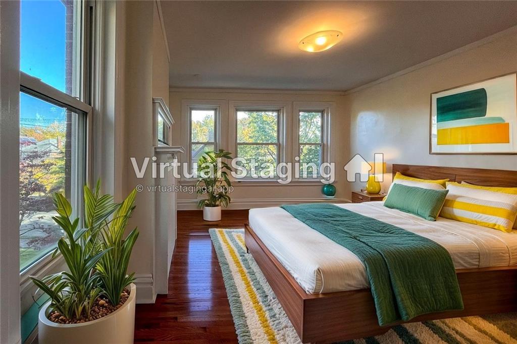 926 Savannah Avenue, Unit 2 Regent Square, PA 15221 - Photo 12 of 13 a bed sitting in a bedroom next to a balcony