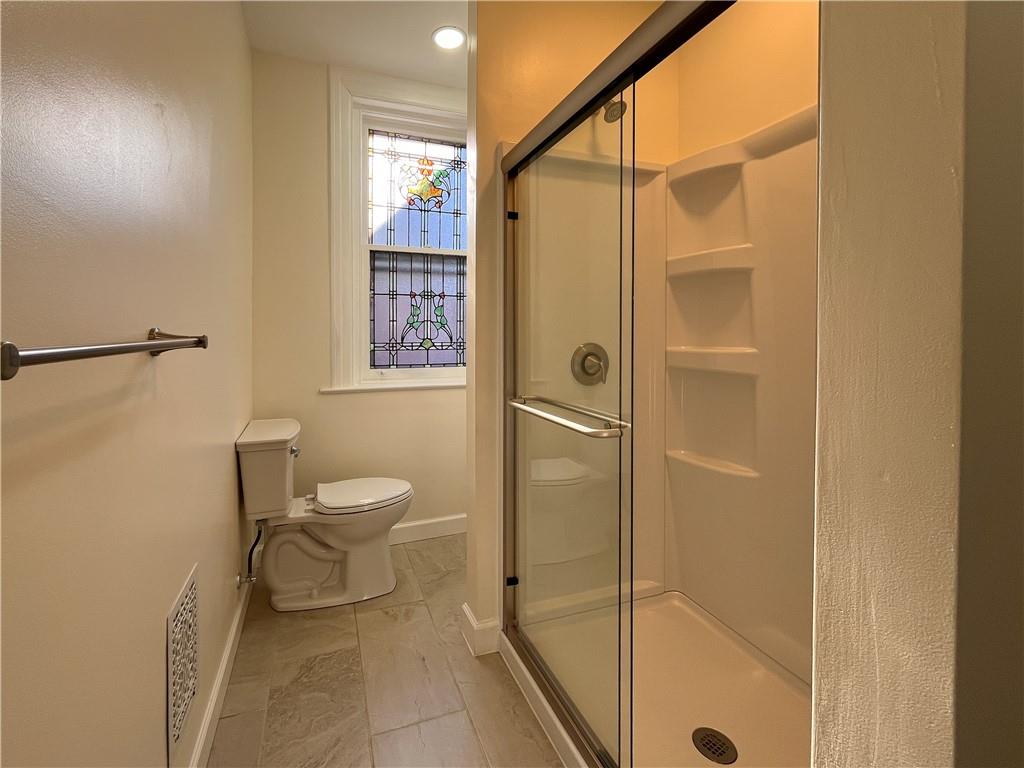 926 Savannah Avenue, Unit 2 Regent Square, PA 15221 - Photo 8 of 13 a bathroom with a toilet and a shower