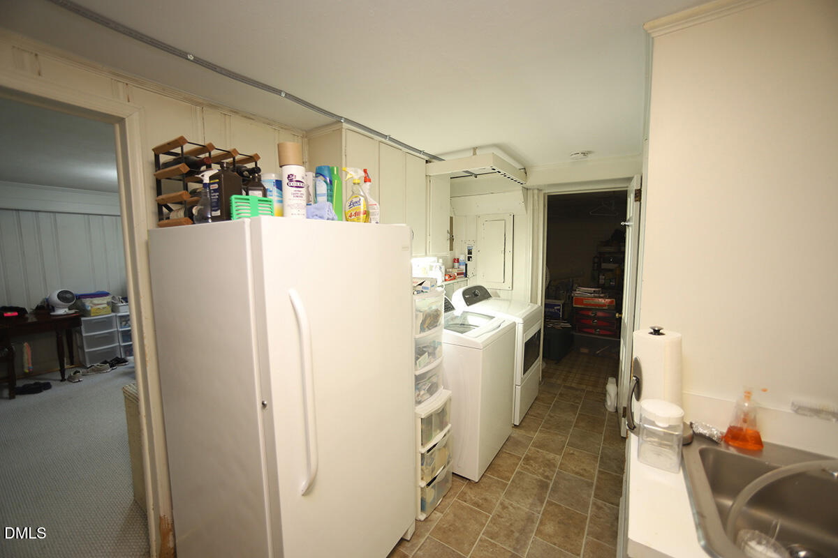 2601 York Road Raleigh, NC 27608 - Photo 19 of 24 a white refrigerator freezer sitting inside of a kitchen