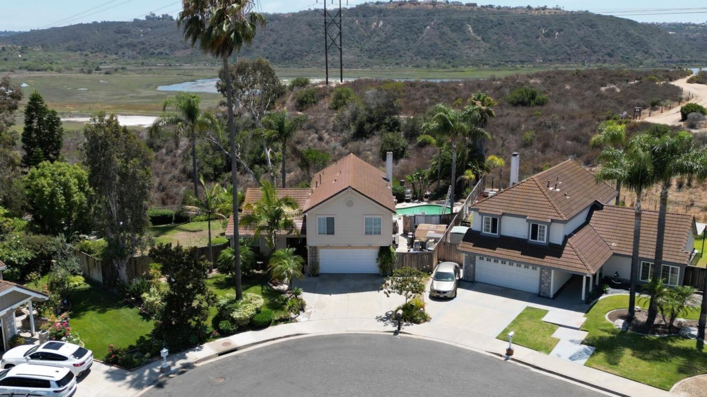 7259 Mimosa Drive Carlsbad, CA 92011 - Photo 3 of 19 an aerial view of a house with garden space and lake view