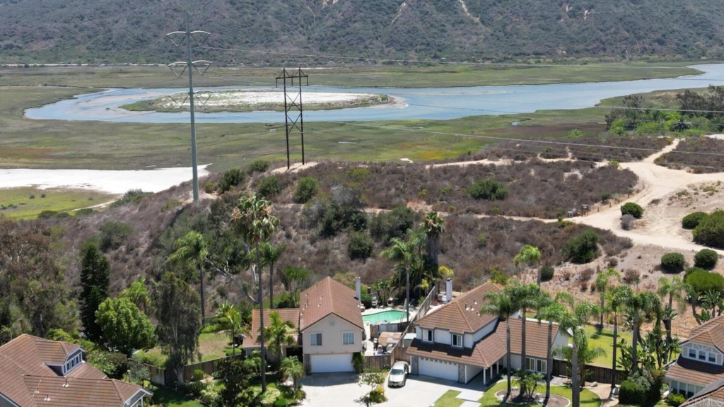 7259 Mimosa Drive Carlsbad, CA 92011 - Photo 7 of 19 a view of a lake with a house