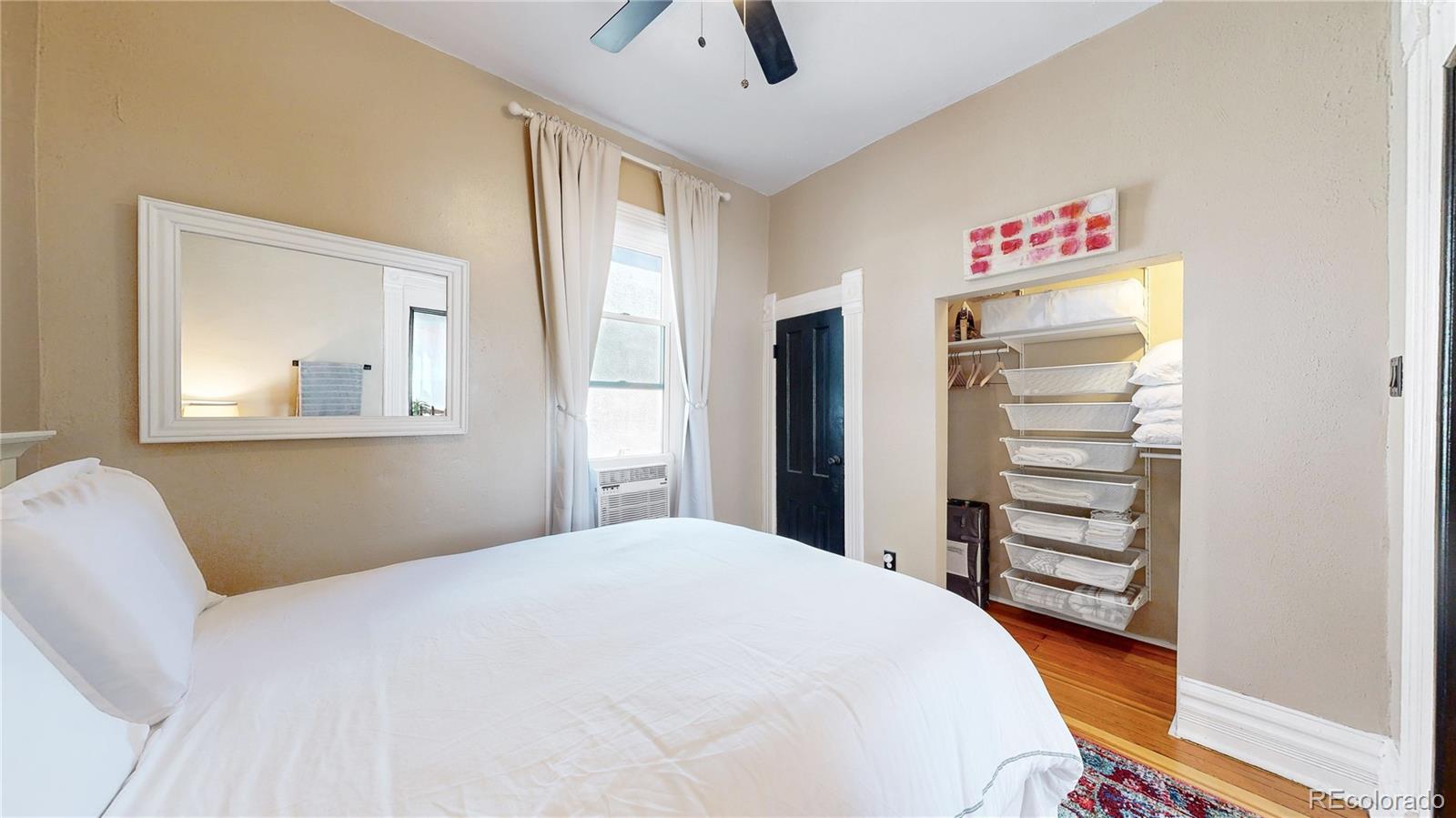 2733 Humboldt Street Denver, CO 80205 - Photo 12 of 40 a bedroom with a bed and a window