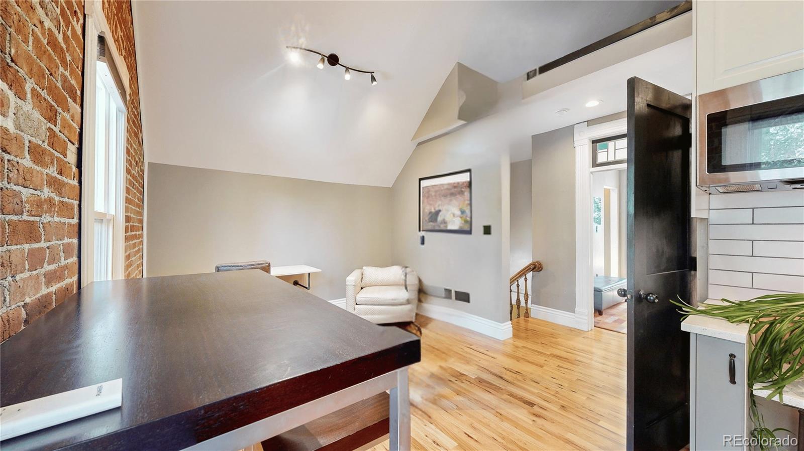 2733 Humboldt Street Denver, CO 80205 - Photo 15 of 40 a view of a living room and dining room