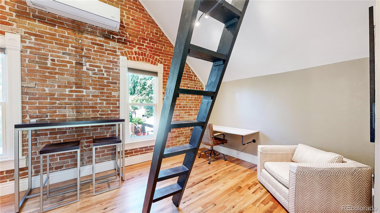 2733 Humboldt Street Denver, CO 80205 - Photo 16 of 40 a living room with furniture and a window