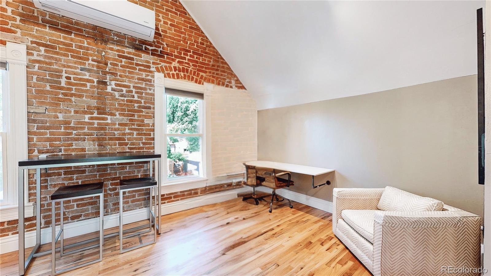 2733 Humboldt Street Denver, CO 80205 - Photo 17 of 40 a living room with furniture and a wooden floor