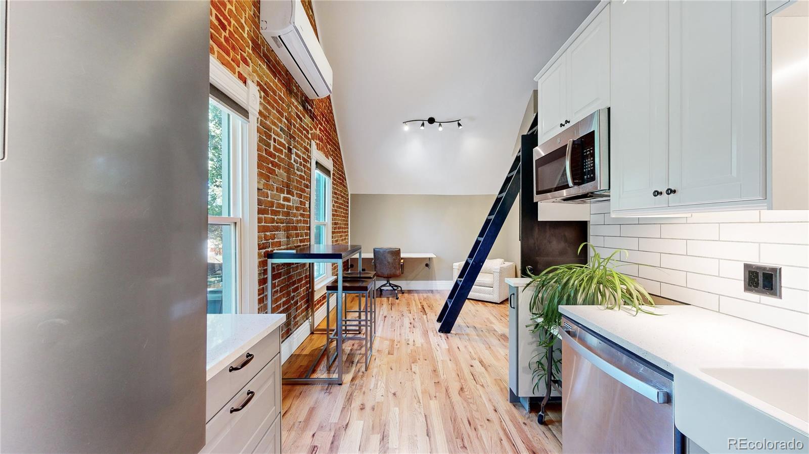 2733 Humboldt Street Denver, CO 80205 - Photo 19 of 40 a view of stairs and furniture