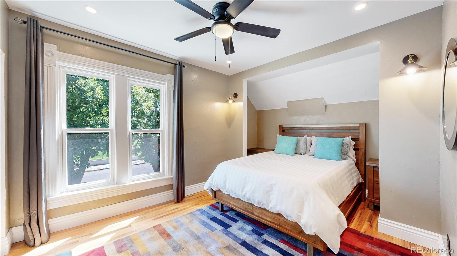 2733 Humboldt Street Denver, CO 80205 - Photo 22 of 40 a bedroom with a bed and a window