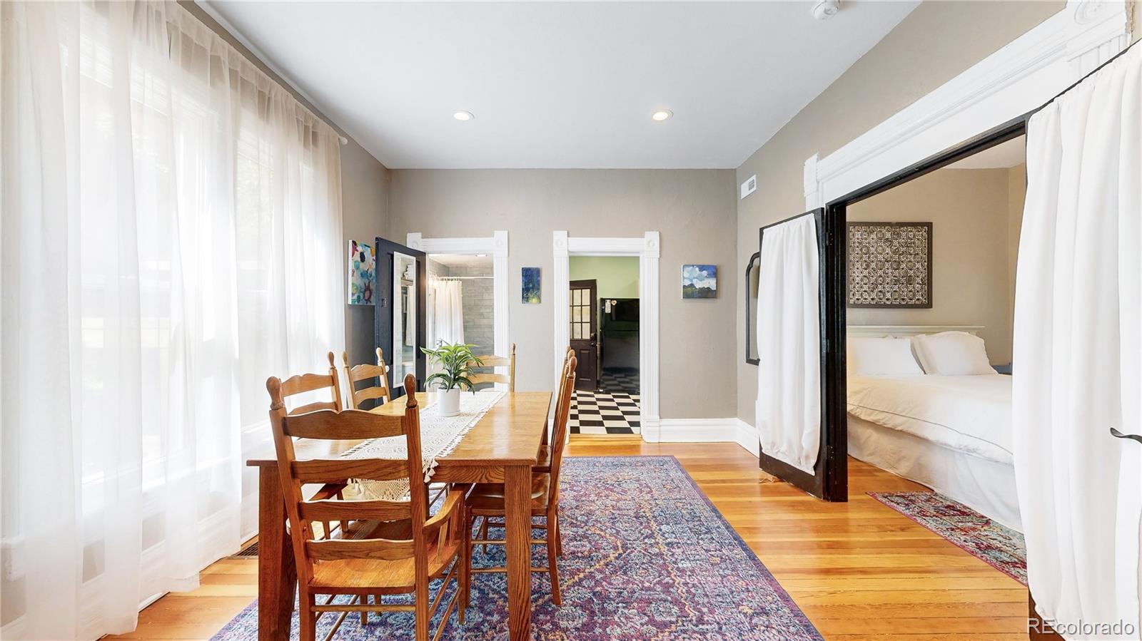 2733 Humboldt Street Denver, CO 80205 - Photo 7 of 40 a dining room with furniture and wooden floor