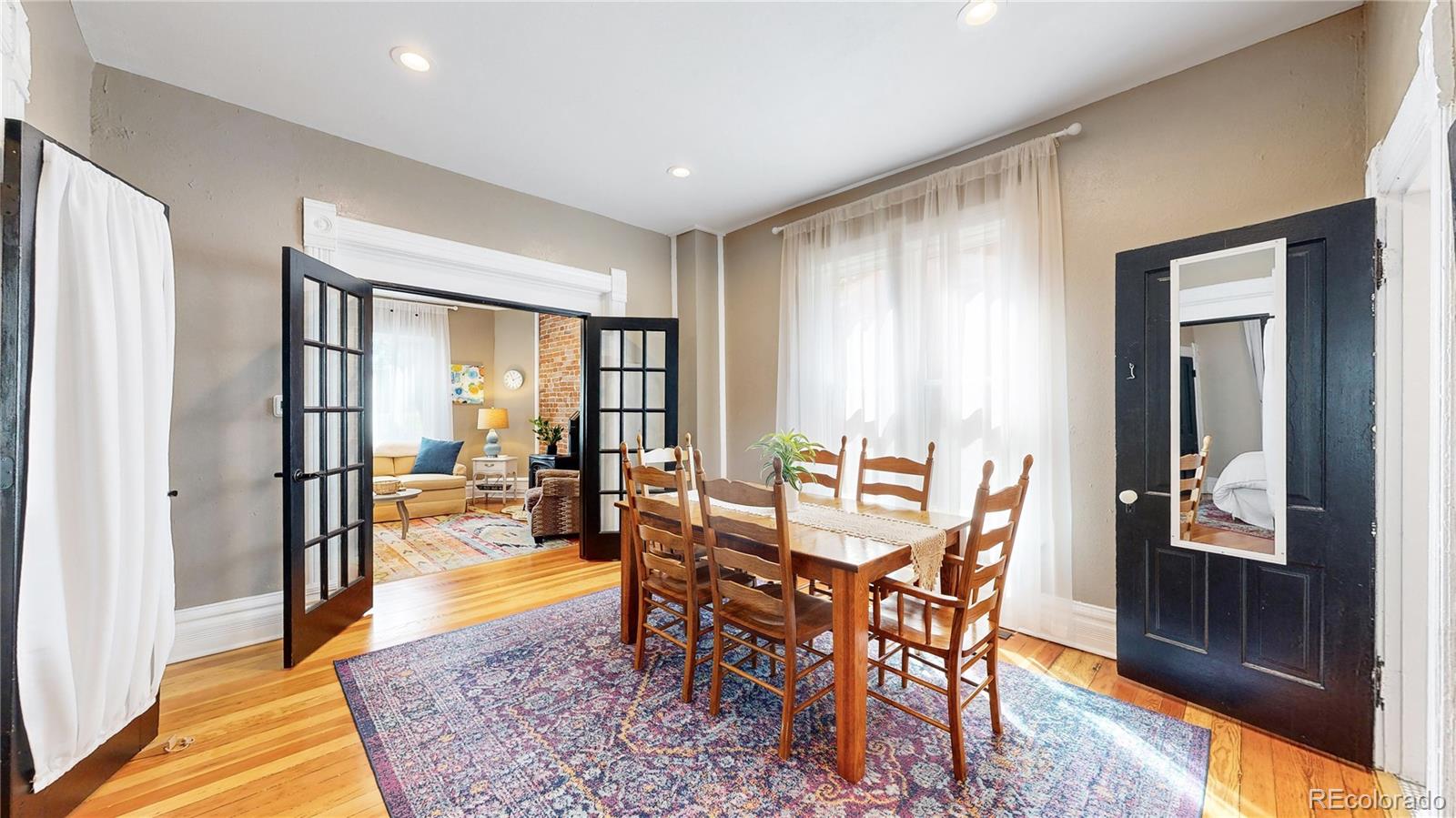 2733 Humboldt Street Denver, CO 80205 - Photo 8 of 40 a view of a dining room with furniture window and wooden floor