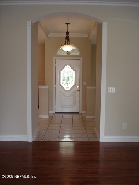 600 Roberts Road Fruit Cove, FL 32259 - Photo 9 of 9 a view of an empty room with wooden floor and a window
