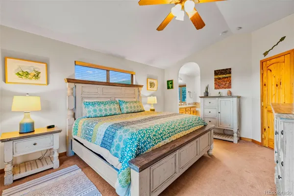a bed room with a bed and a night stand
